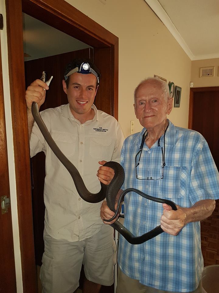 Nick and his grandpa after catching the snake.