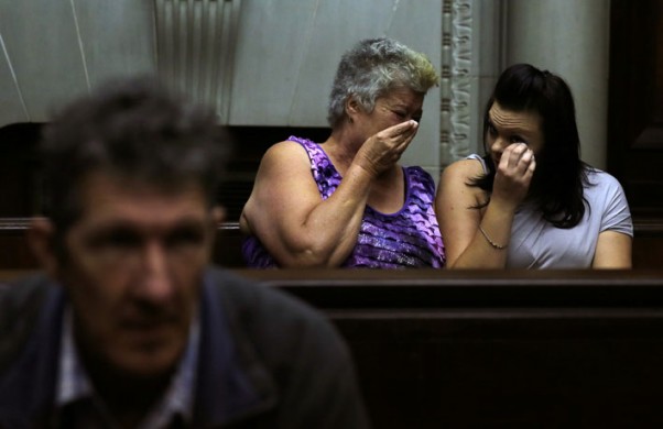 FILE PICTURE: Katrina Mare, mother of dismembered teenager Chairmaine Mare, and a friend Nikita Small react during the court appearance of Johannes Christiaan de Jager (foreground) at the Western Cape High Court in Cape Town on Tuesday, 15 April 2014. Picture: Nardus Engelbrecht/SAPA