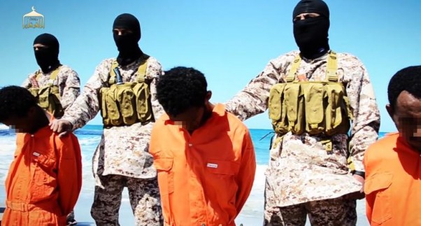Al-Furqan Media/AFP / <br />Men described as Ethiopian Christians captured in Libya kneeling on the ground in front of masked militants before their beheading on a beach at an undisclosed location in Libya