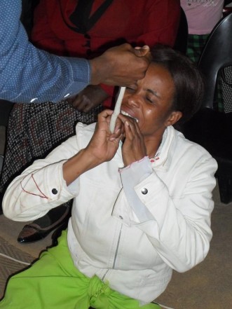 Pastor Mnguni makes his congregant eat a snake. Picture: Facebook