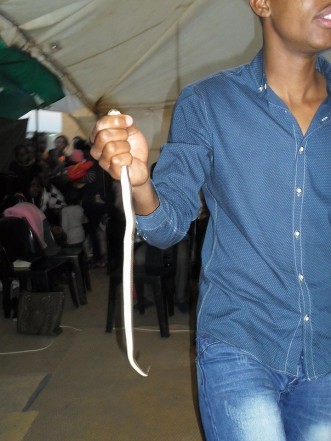Pastor Mnguni makes his congregants eat a snake. Picture: Facebook