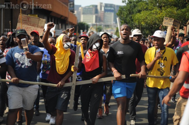 Wits students march through the Johannesburg CBD to Luthuli House, 22 October 2015, during the #FeesMustFall national protest. Students gathered outside the ruling party’s offices where they handed over a memorandum of grievances. Picture: Alaister Russell