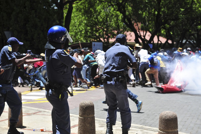 Police fire rubber bullets and stun grenades on the campus of the University of Pretoria as protesters from Unisa join forces with protesters at the UP on 12 January 2016. Protests were ongoing since last year around outsourcing and student financing. Picture: Christine Vermooten