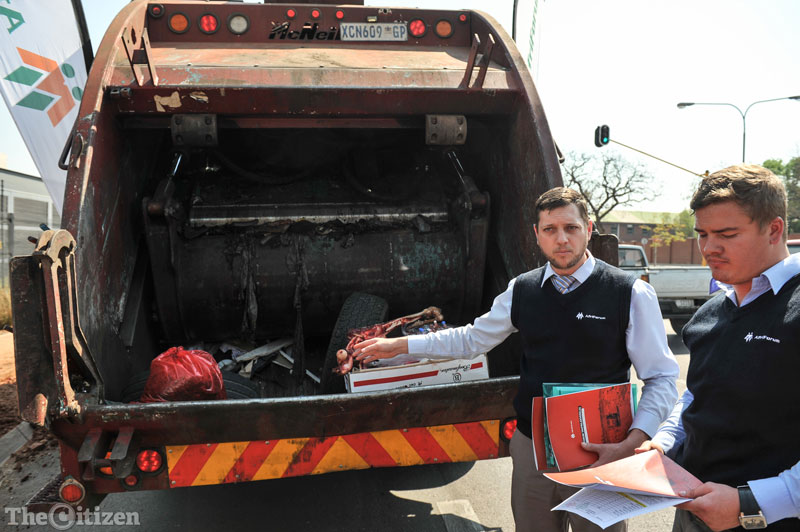 Marcus Pawson, Afriforum's head of Local Government is seen refering to medical Waste, an animal carcass and tyres on the back of a dumptruck, these are items frequently found in dumpsites in Gauteng, which are items that are not allowed to be dumped on these sites, infront of the Department of Enviromental Affairs, 8 September 2016, Pretoria. Picture: Jacques Nelles