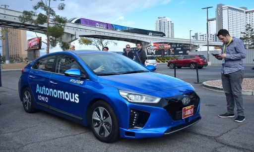Hyundai's Autonomous IONIQ vehicle is taken for a test-ride at the 2017 Consumer Electronics Show in Las Vegas, Nevada, on January 4, 2017. / AFP PHOTO / Frederic J. BROWN