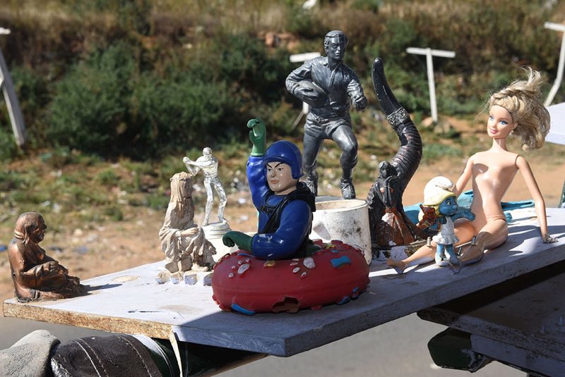 Salvaged memorobilia, toys and statuettes decorate a room in Marula City.