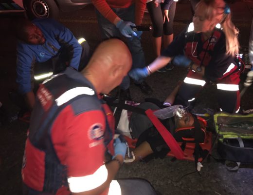Paramedics attend to the driver