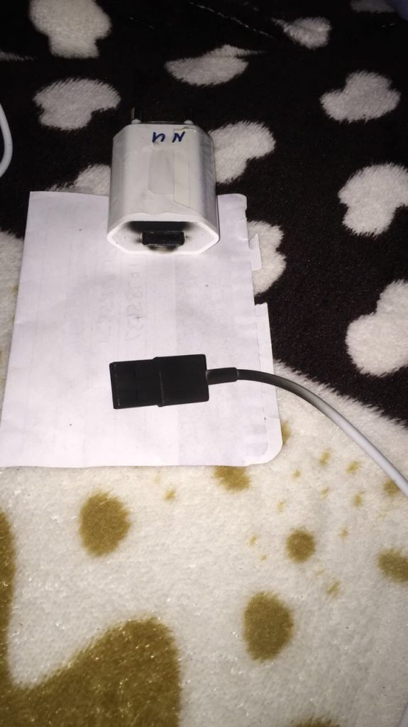 A phone charger that caught alight following the power surge.