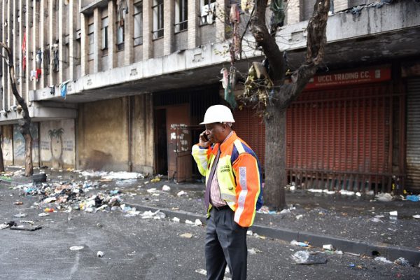 Executive mayor Herman Mashaba visits the scene of the Cape York building on the corner of Nugget and and Jeppe street in Hillbrow that caught fire, 5 July 2017. One person died after jumping from the second floor of the building, while six others burnt to death or died from smoke inhalation according to the EMS on the scene. Some residents made ropes from sheets to get out, while some refused to leave the hijacked building. Picture: Tracy Lee Stark