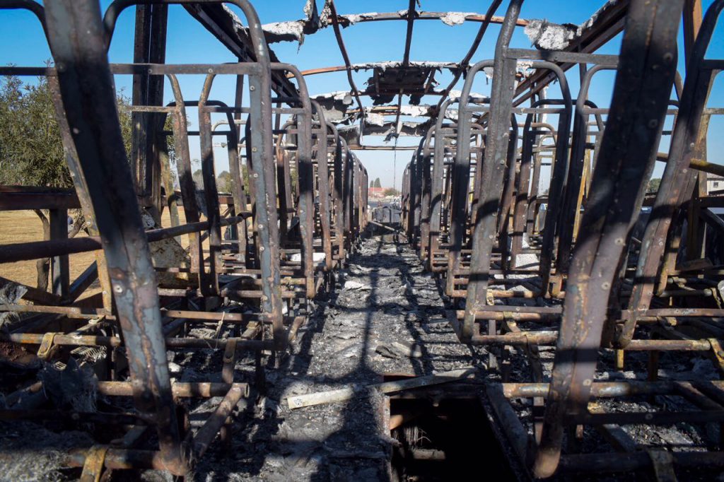 Klipspruit residents set a bus alight during protest