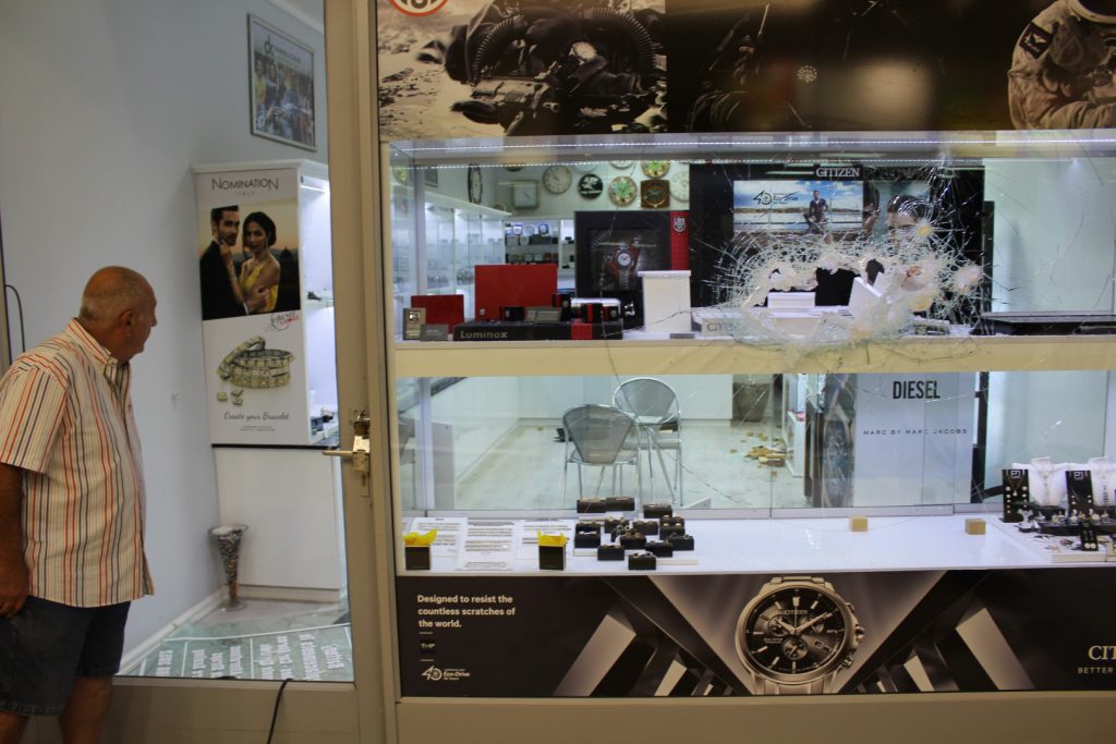Owner of The Watch Movement, Brian Diab, surveys the damage done to his shop in the break-in.