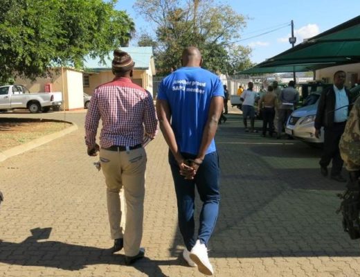 Cop also charged with corruption are taken away