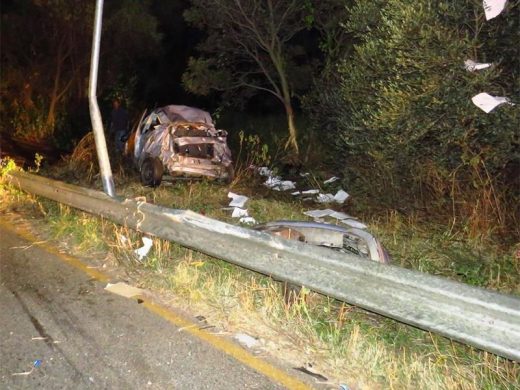 The remains of the vehicle, which went through the crash barrier.