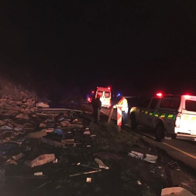 Emergency services on the scene in the early hours of Sunday morning 3 September, with what's left of the truck's cargo.