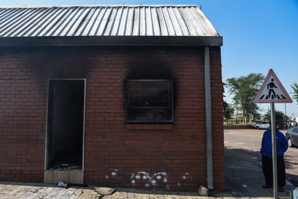 Smoke is seen coming from a building by a taxi rank in Hammanskraal after it was burnt by disgrunteled commuters when taxi drivers embarked on a strike, 7 February 2018, Pretoria. Picture: Jacques Nelles