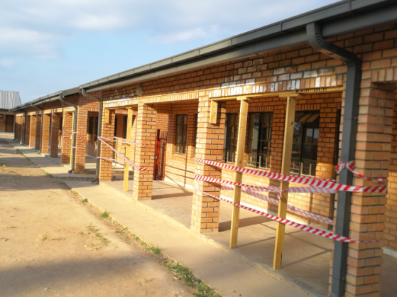 Sections of walls in front of some new classrooms at Vhafamadi High School have had to be propped up because of structural problems caused by poor workmanship | Photo: Raymond Joseph, Ground Up 