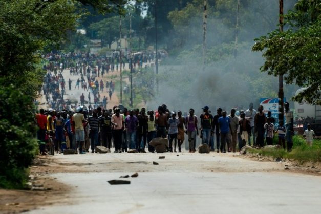 Nationwide demonstrations erupted after Zimbabwe's president announced that fuel prices were being more than doubled . AFP/File/Jekesai NJIKIZANA