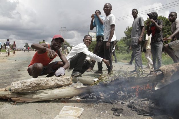 Zimbabwe erupted in violent protest after the government doubled the price of petrol. EPA-EFE/Aaron Ufumeli