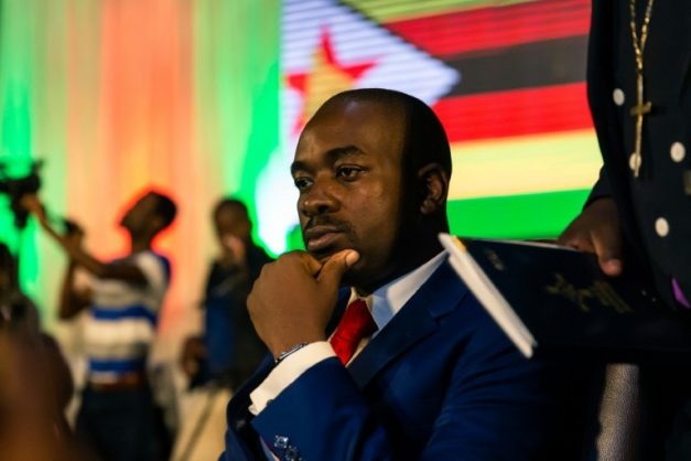 Zimbabwean opposition leader Nelson Chamisa of the MDC Alliance listens to participants during a prayer as part of a meeting organized by a coalition of Christian churches to facilitate dialogue between political party leaders . AFP/File/Jekesai NJIKIZANA