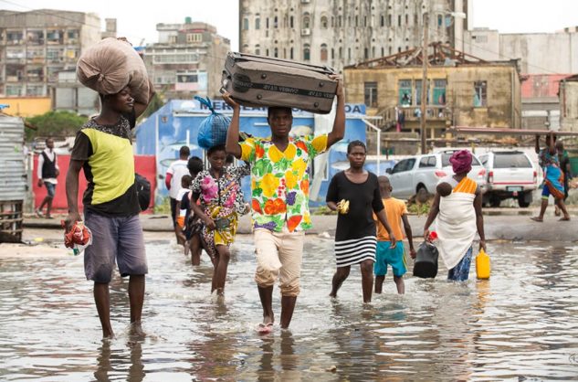 People leaving their homes in the flooded section of Praia Nova, Beira, Mozambique in the wake of tropical cyclone Idai.
Denis Onyodi/ IFRC handout