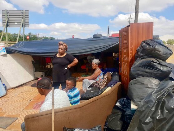Ten members of the May family have been squatting outside the farm gates ever since their eviction, with all their belongings, including couches, mattresses and a cupboard, and only a plastic sheet to cover them. Photo supplied