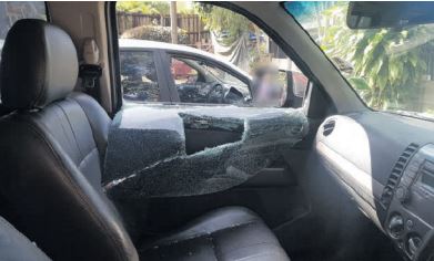 The windows of a vehicle belonging to a former SA Revenue Service high-risk investigation unit member are smashed outside the Durban Sars office, 15 August 2019. Picture: Supplied