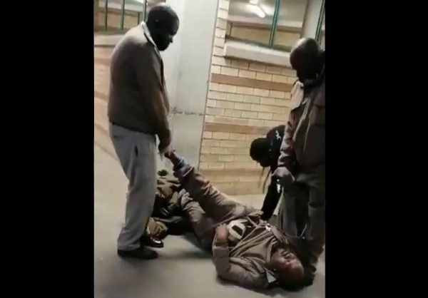 Watch: Prison guards catch one of their own smuggling in contraband strapped to his body