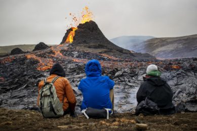 Sunday hikers look at the lava flowing from the erupting Fagradalsfjall volcano some 40 km west of the Icelandic capital Reykjavik, on 21 March 2021. Weekend hikers took the opportunity on Sunday to inspect the area where a volcano erupted in Iceland on 19 March, some 40 kilometres from the capital Reykjavik, the Icelandic Meteorological Office said, as a red cloud lit up the night sky. Picture: Jeremie RICHARD/AFP