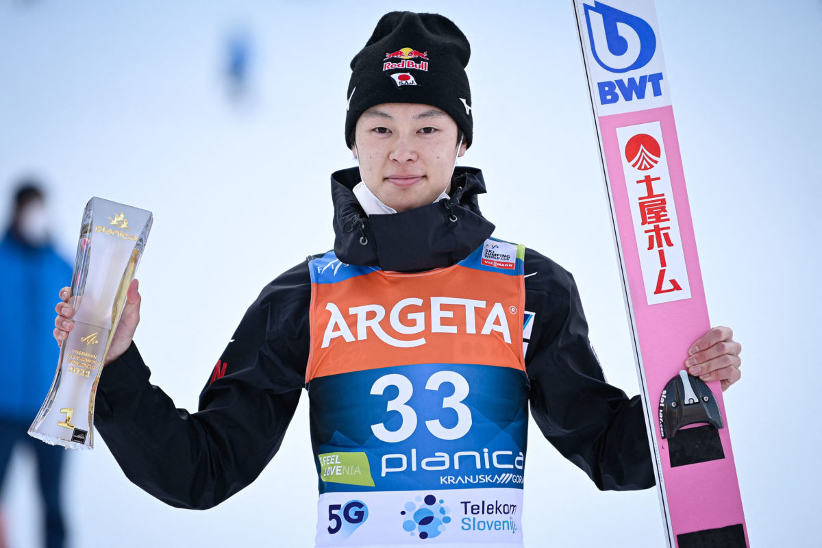 Japan's Ryoyu Kobayashi poses for photos with his trophy after winning the FIS Ski Jumping World Cup Flying Hill Individual competition in Planica on March 25, 2021. (Photo by Jure Makovec / AFP)