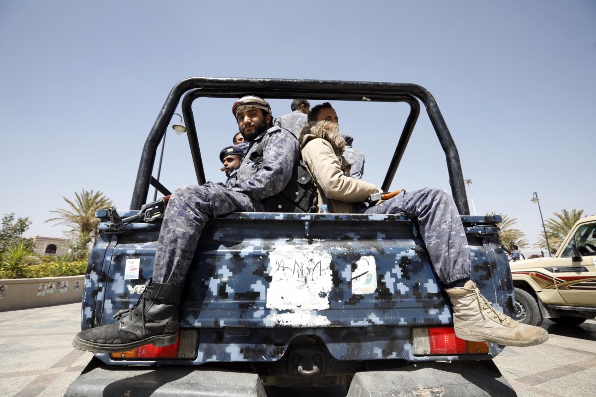 Pro-Houthi soldiers riding a truck