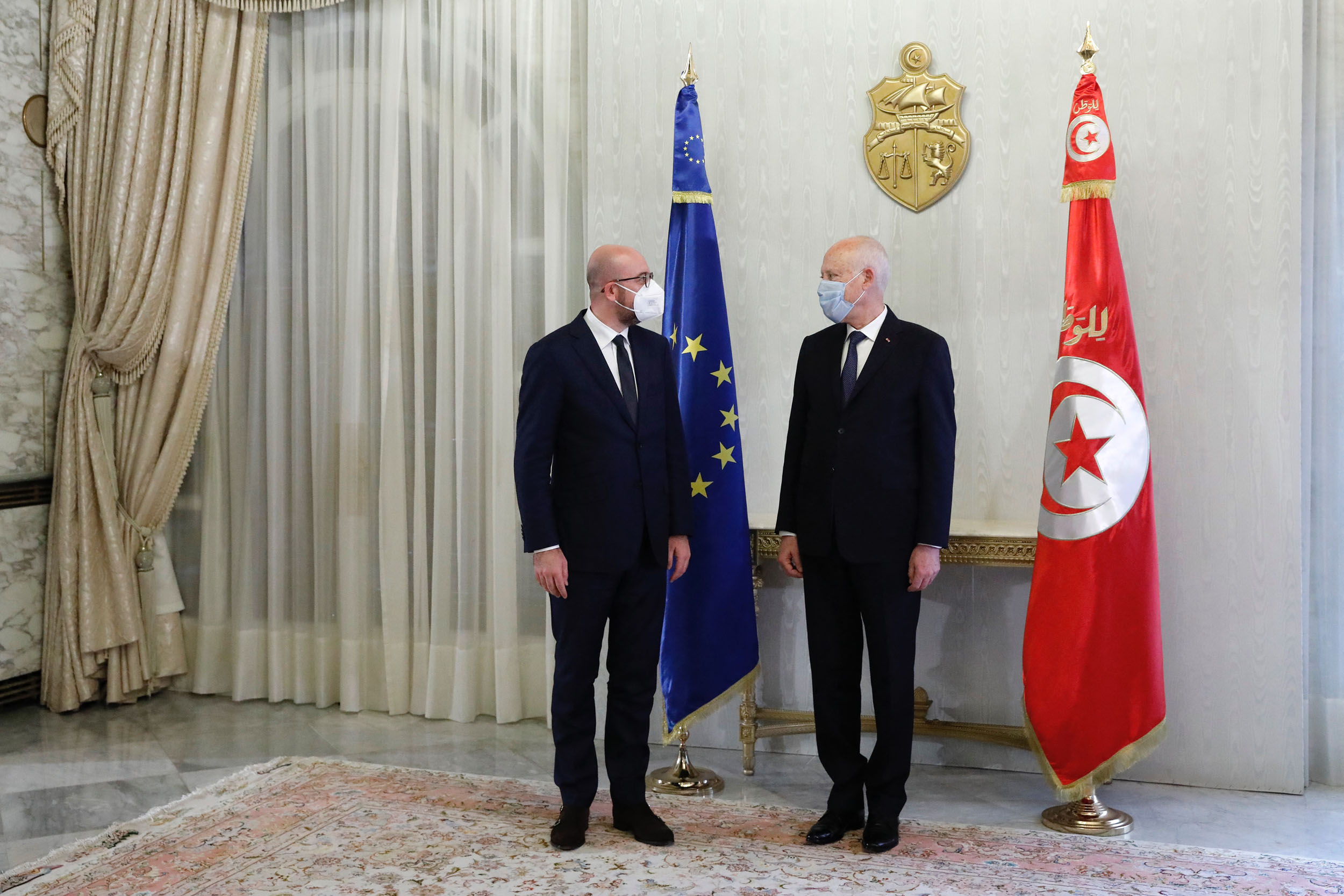 This handout picture released by the European Council (EC) on April 5, 2021 shows President of the European Council Charles Michel (L) meeting with Tunisia's President Kais Saied (R) at Carthage Palace east of the capital Tunis. (Photo by DARIO PIGNATELLI / EBS / AFP) / XGTY / RESTRICTED TO EDITORIAL USE - MANDATORY CREDIT "AFP PHOTO / EUROPEAN COUNCIL/ DARIO PIGNATELLI" - NO MARKETING - NO ADVERTISING CAMPAIGNS - DISTRIBUTED AS A SERVICE TO CLIENTS