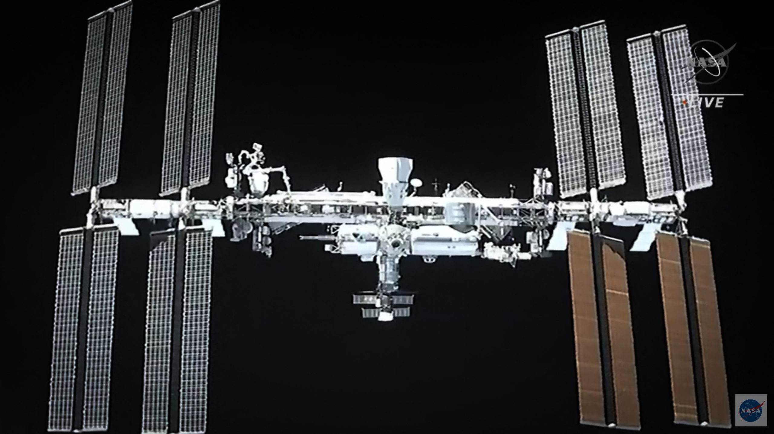 A recycled SpaceX Crew Dragon capsule with four astronauts docks at ISS