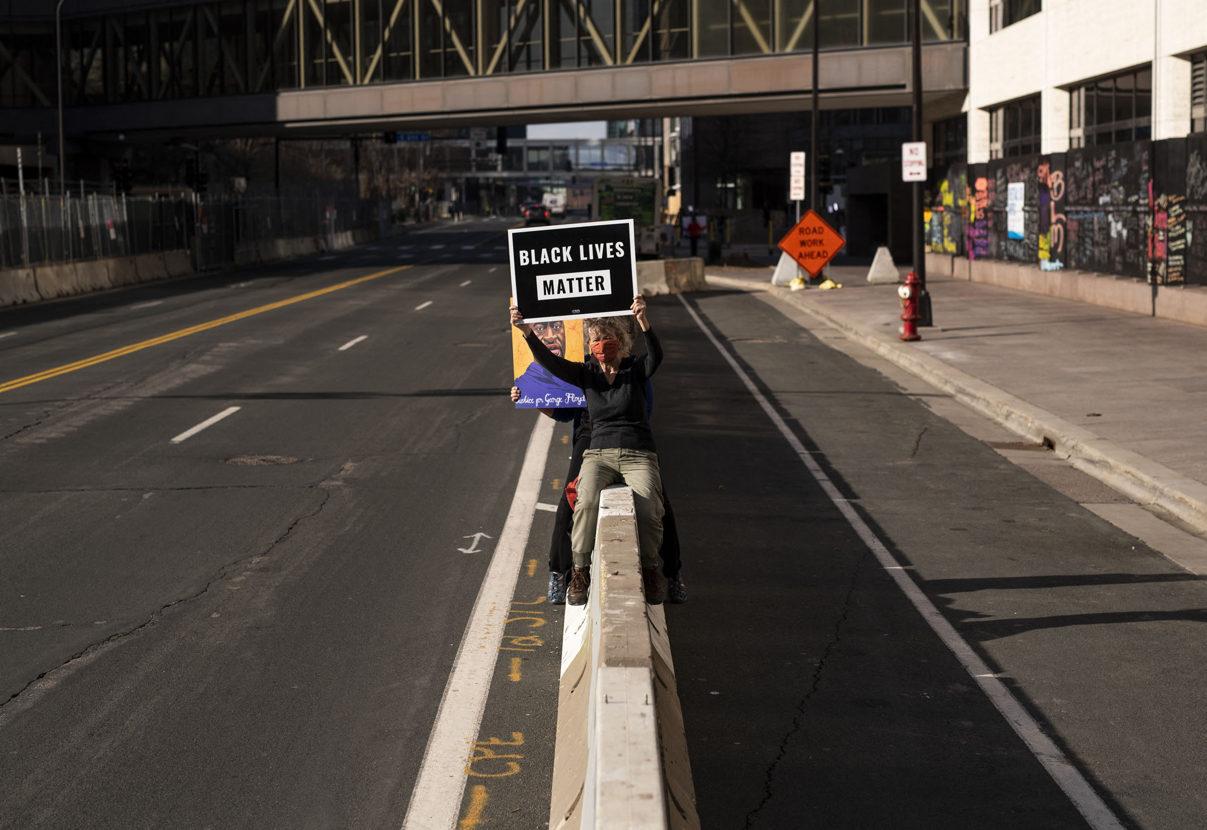MINNEAPOLIS, MN - APRIL 5: Wendy McCully holds a Black Lives Matter sign outside the Hennepin County Government Center on April 5, 2021 in Minneapolis, Minnesota. The Derek Chauvin murder trial continues today, the former Minneapolis Police officer is accused of multiple counts of murder in the death of George Floyd last May. Stephen Maturen/Getty Images/AFP (Photo by Stephen Maturen / GETTY IMAGES NORTH AMERICA / Getty Images via AFP)