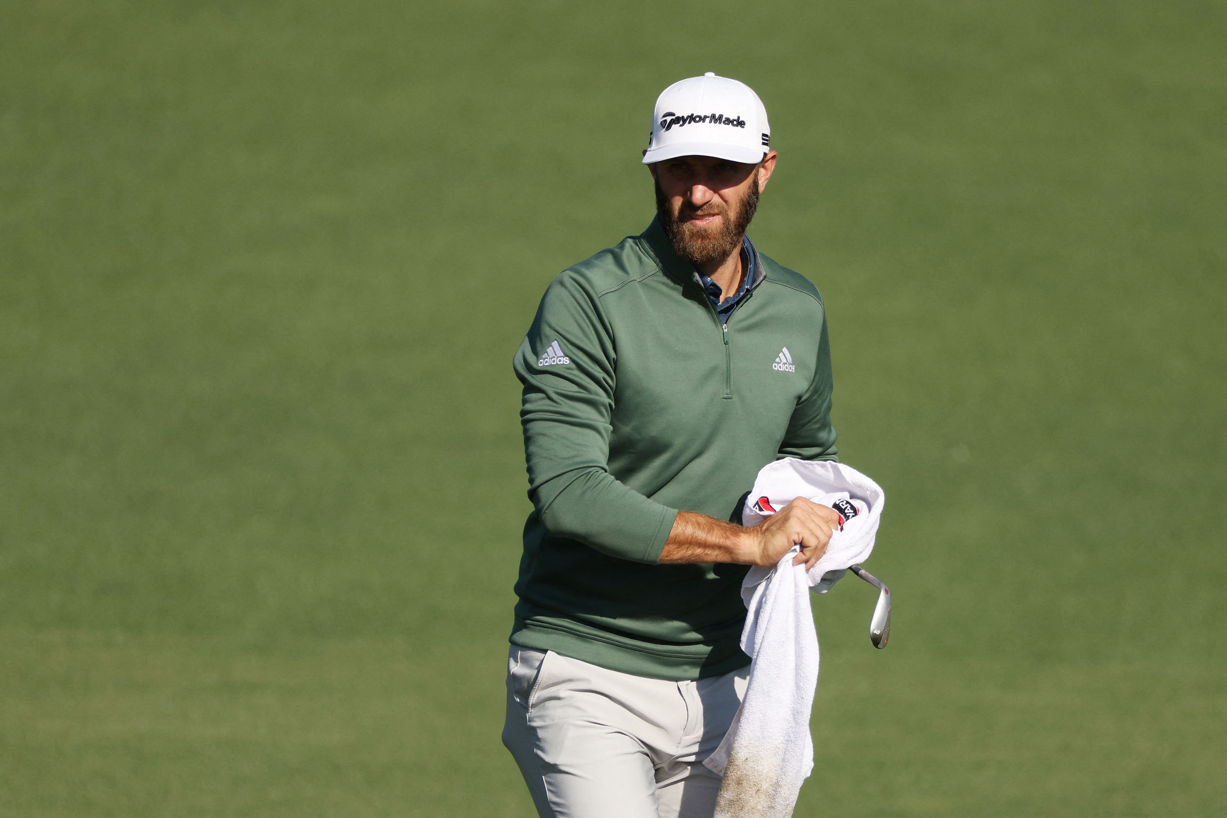 AUGUSTA, GEORGIA - APRIL 05: Dustin Johnson of the United States looks on from the second hole during a practice round prior to the Masters at Augusta National Golf Club on April 05, 2021 in Augusta, Georgia. Kevin C. Cox/Getty Images/AFP (Photo by Kevin C. Cox / GETTY IMAGES NORTH AMERICA / Getty Images via AFP)