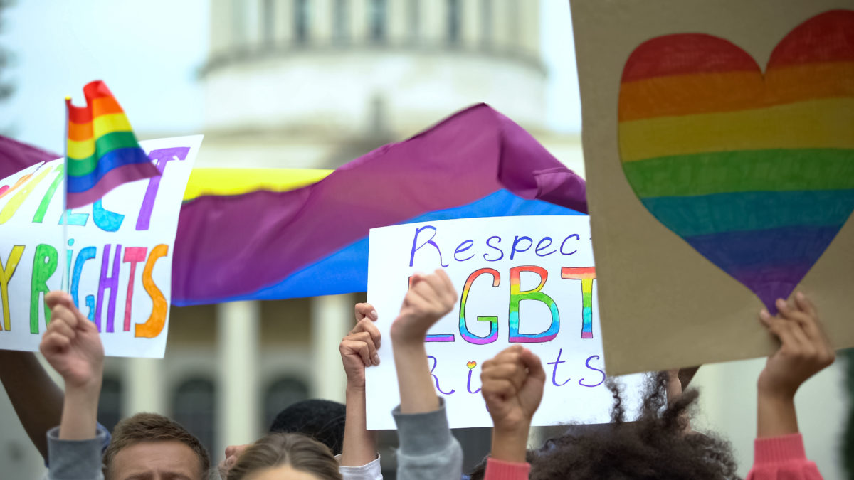 Crowd with LGBTQIA+ posters