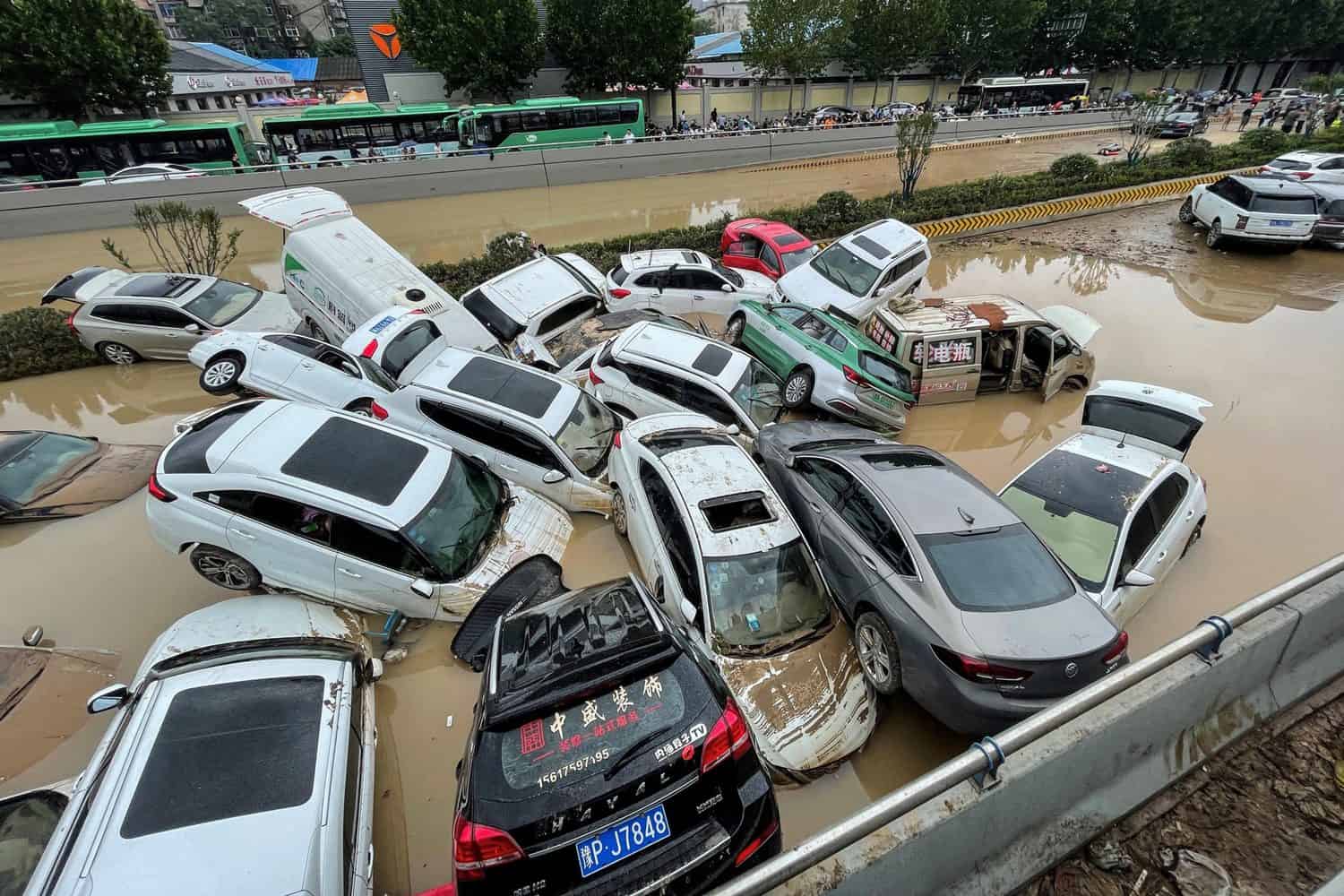Chinese city picks through the debris after record rains kill 33