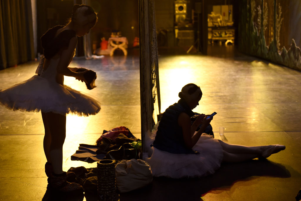Ballerinas get get ready to leave the stage after of a performance of Swan Lake. Picture: Tracy Lee Stark