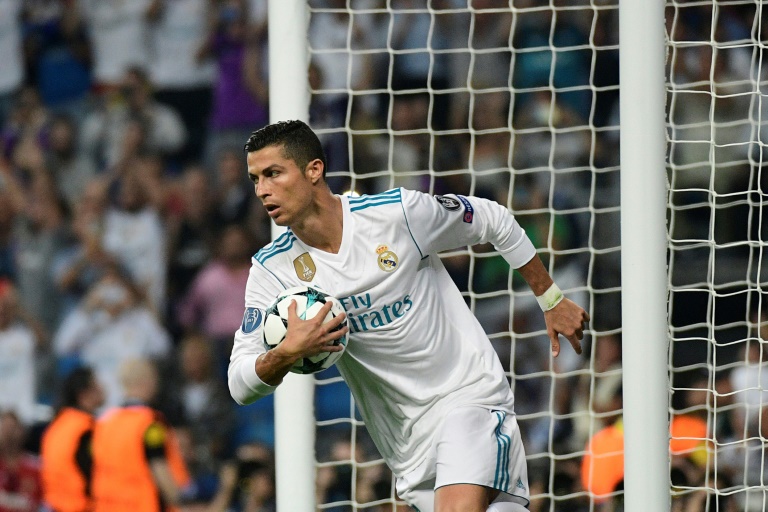 Real Madrid's forward Cristiano Ronaldo celebrates after scoring on a penalty kick at the Santiago Bernabeu stadium in Madrid on September 13, 2017