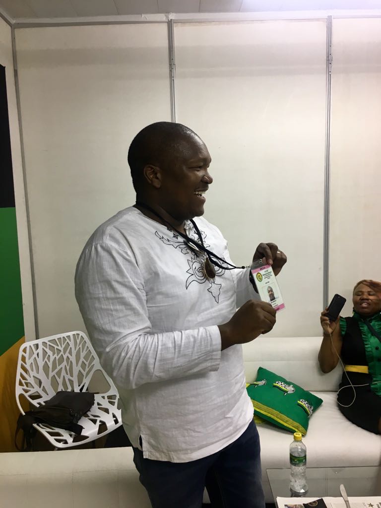 Sam Mkhokheli displaying his repatriated accreditation in the media lounge at Nasrec.