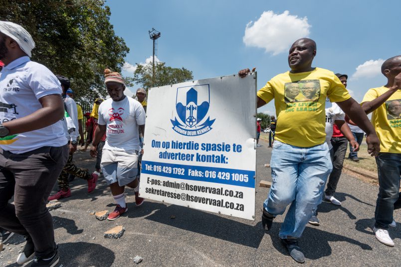 Protesters march with a sign ripped from the walls outside Hoerskool Overvaal in Vereeniging on January 18, 2018. Picture: Yeshiel Panchia