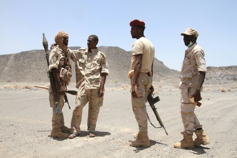 Sudanese soldiers patrol outside the west of the Yemeni coastal port town of Mokha
