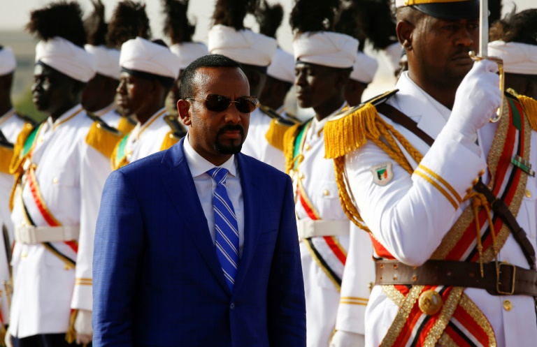 Ethiopian Prime Minister Abiy Ahmed reviews the honour guard following his arrival in Khartoum for an official visit to Sudan on May 2, 2018